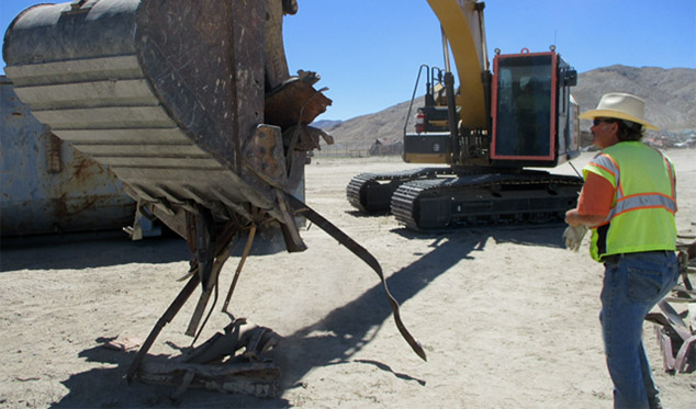 QA Services Gallery Image - Inspecting a load of metal prior to recycling.
